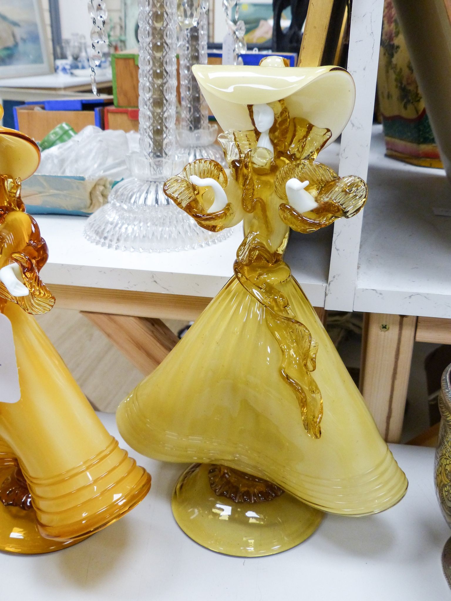 A collection of eight Murano amber glass figures, tallest 42cm